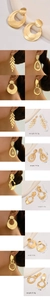 Detailed view of large gold-finish earrings with size and weight measurements in cm