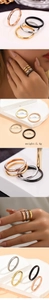 Close-up of a minimalist four-piece stackable ring set in four distinct metallic finishes