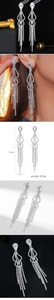 Sparkling silver tassel drop earrings with dimensions of 8.8cm length and 1.7cm width