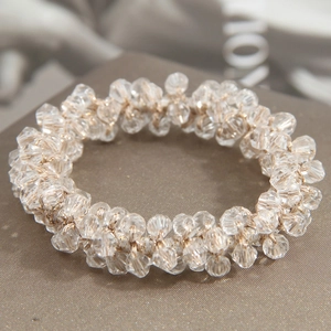 Elegant beaded hair scrunchie with faceted clear crystals and gold wire woven design