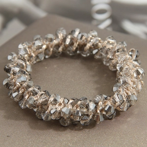 Elegant beaded hair tie with smoked grey crystals and gold woven elastic band