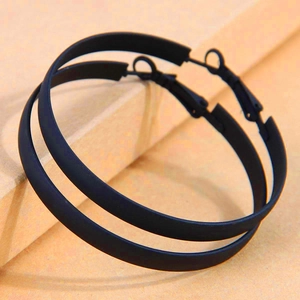 Minimalist matte black metal hoop earrings with wide flat round design and pin closure