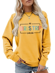 Detail of Ginger yellow Girls Trip 2026 sweatshirt with ribbed cuffs and rainbow print