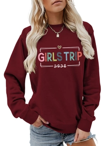 Detail of Girls Trip 2026 lettering and leopard heart on wine red crewneck sweatshirt