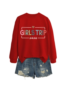 Red Girls Trip 2026 sweatshirt paired with frayed denim shorts in a flat lay view