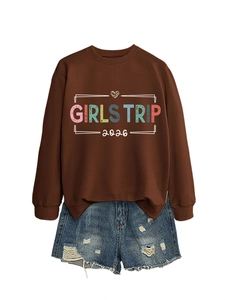 Close-up of Girls Trip 2026 lettering and leopard heart on brown sweatshirt