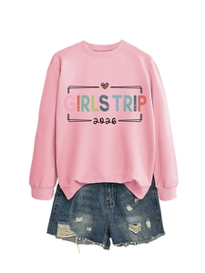 Detailed view of pink sweatshirt with Girls Trip 2026 print and leopard heart logo