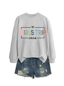 Detailed view of light gray sweatshirt with Girls Trip 2026 text and leopard heart print