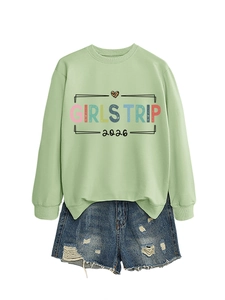 Detail of Girls Trip 2026 sweatshirt with rainbow text and leopard print heart graphic