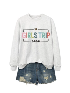 Detail of Girls Trip 2026 sweatshirt with leopard heart and distressed denim shorts