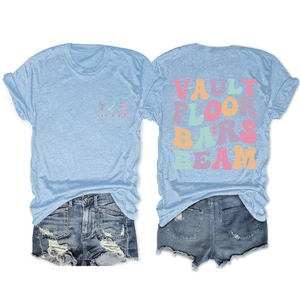 Detail of light blue crew neck T-shirt with gymnastics theme print and denim shorts
