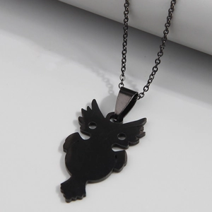 Minimalist black stainless steel owl pendant necklace with matte finish on grey background