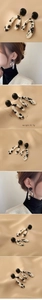 Detail view of U-shaped marble resin earrings with dimensions 6.3cm x 3.0cm and weight