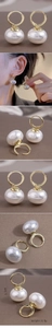 Elegant gold hoop earrings with white oval pearls showing size 2.5cm and weight 4.9g