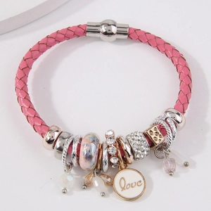 Pink woven leather bracelet with Love charms and magnetic clasp on white background