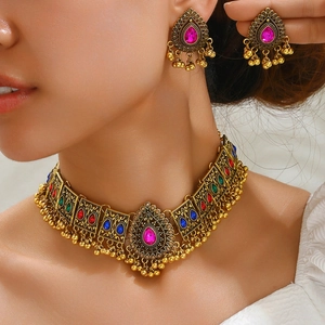 Vintage Middle Eastern style peacock necklace and earrings set with colorful rhinestones