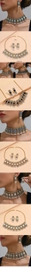 Detail of vintage gold jewelry set with colorful gemstones, pearls and size specs
