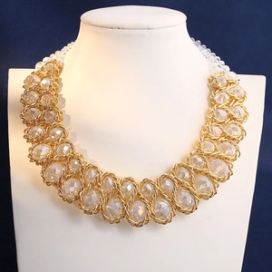 Statement chunky necklace with large faceted crystals and gold braided metal chains