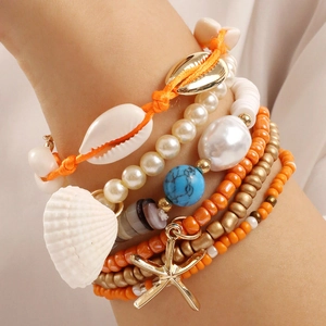 Bohemian multi-layer bracelet set featuring starfish, shells, turquoise and orange beads