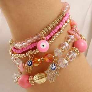 Bohemian multi-layer beaded bracelet set featuring pink resin beads and Hamsa Hand charm