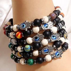 Ensemble de bracelets bohèmes multicouches avec main de Fatma et breloque œil bleu