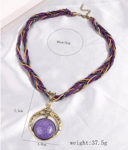 Bohemian purple stone necklace with vintage gold crescent pendant and woven chain details