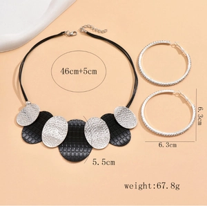 Detail showing dimensions of silver oval necklace and large rhinestone hoop earrings