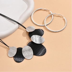 Chic silver hammered metal necklace set with large rhinestone hoop earrings