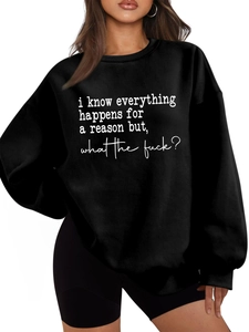 Detail of white graphic text print on black oversized round neck thick sweatshirt