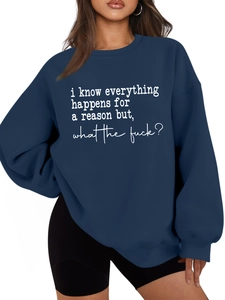 Detail of navy blue oversized sweatshirt with white slogan print and ribbed neckline