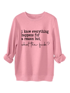 Detail of pink sweatshirt featuring ribbed cuffs and black slogan print on the chest