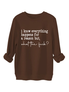 Detail of dark brown crewneck sweatshirt featuring white printed slogan text on front