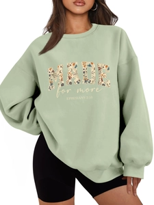 Detail view of avocado green oversized sweatshirt with floral MADE for more print