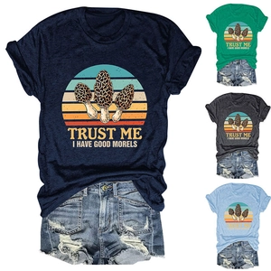 Detail showing various colors of Morel mushroom graphic t-shirts and denim shorts