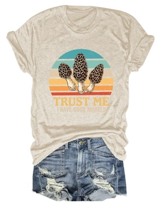 Detailed flat-lay of oatmeal t-shirt featuring retro morel mushrooms and denim shorts