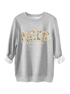 Detail of grey fleece sweatshirt featuring floral MADE for more letter print design