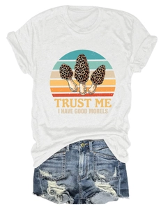 Detailed flat lay of white cotton T-shirt with vintage mushroom graphic and blue denim shorts