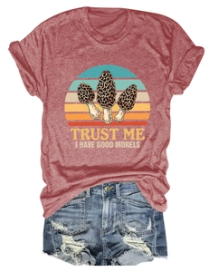 Detail of red T-shirt with Trust Me I Have Good Morels slogan and denim shorts