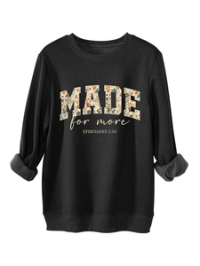 Detail of floral-filled MADE for more text and Bible verse on black sweatshirt