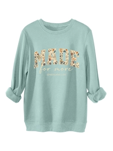 Detail of floral letter print and Bible scripture on mint green crewneck sweatshirt