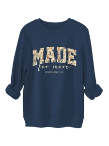 Detail of navy blue sweatshirt showing ribbed cuffs and floral Made For More print