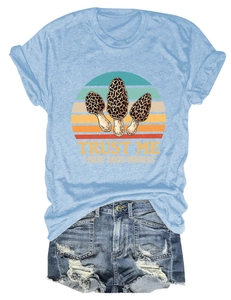 Flat lay of mushroom print t-shirt paired with distressed high-waisted denim shorts