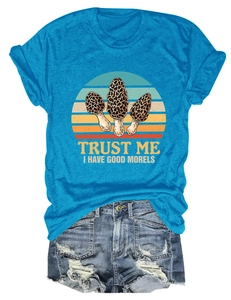 Macro shot of teal cotton T-shirt featuring vintage morel mushroom graphic and typography