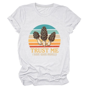 Detail of white cotton T-shirt featuring retro sunset print and mushroom graphic with text