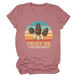 Detail of mushroom print and Trust Me I Have Good Morels text on pink t-shirt