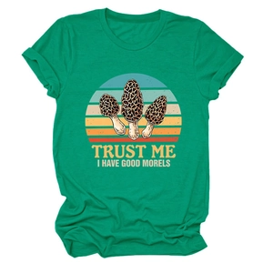 Flat lay of bright green cotton T-shirt featuring vintage mushroom graphic and text print
