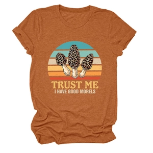 Detail of burnt orange t-shirt featuring mushroom sunset print and witty slogan