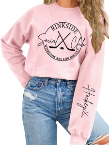 Pink crewneck sweatshirt with Rinkside Social Club print and hockey sleeve detail