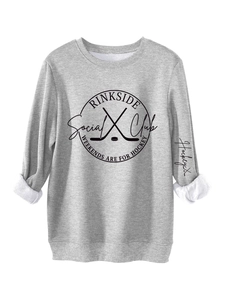 Close-up of Rinkside Social Club hockey print and ribbed cuff on grey warm sweatshirt
