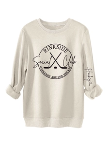 Detail of Rinkside Social Club print on warm cream fleece sweatshirt with ribbed cuffs